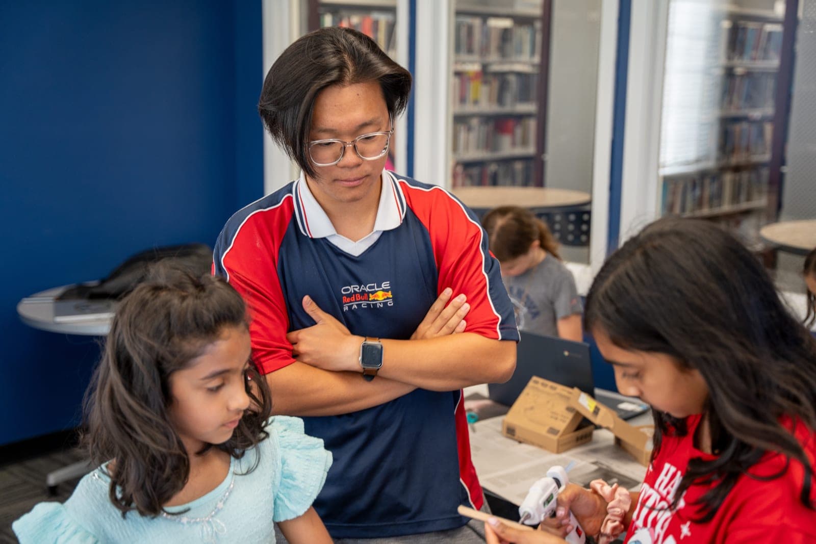 Students and families actively building, testing, and discussing at an Avanza STEM community workshop